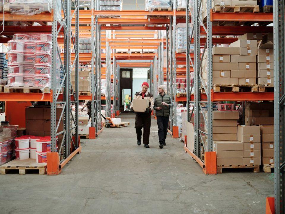 Warehouse workers managing temporary import inventory in a facility subject to Annex 24 compliance in Mexico