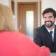 Recruiter interviewing candidate in a professional office setting, representing modern talent acquisition and hiring process