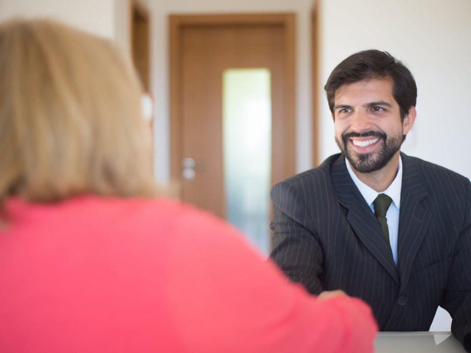 Recruiter interviewing candidate in a professional office setting, representing modern talent acquisition and hiring process
