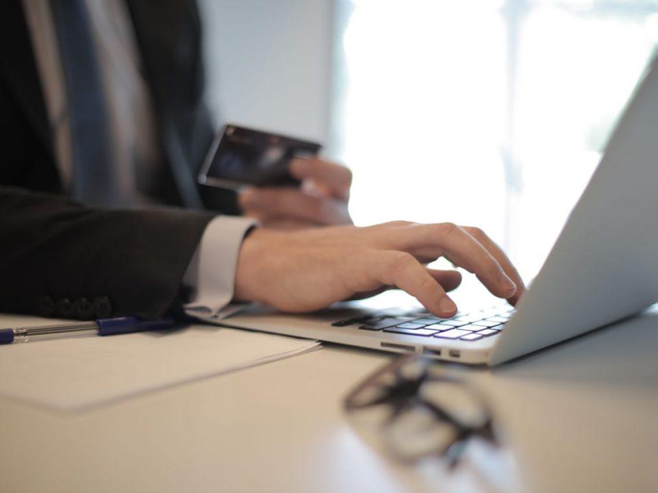 Business professional accessing an online banking platform, representing secure bank account administration in Mexico